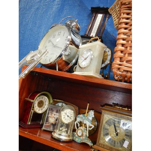 695 - A large quantity of mantel clocks.