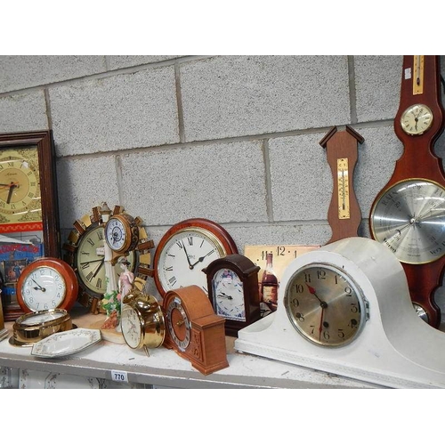 770 - A large shelf of mantel clocks.