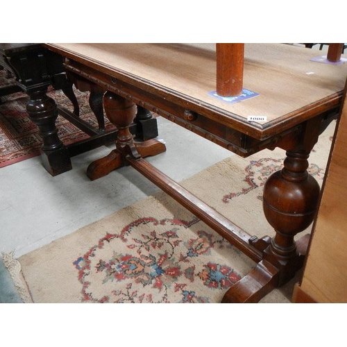 1000 - An early 20th century metamorphic oak table.