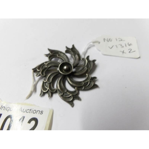 1012 - A Mari-Lou swirl brooch in silver, vintage stamped, together with a silver brooch/clip stamped Black... 