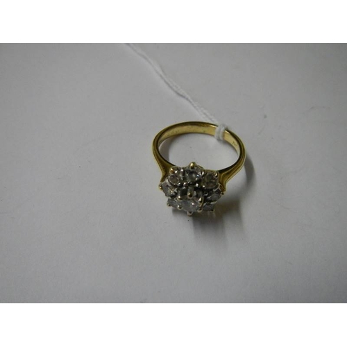 1023 - A 1 carat diamond floral ring set in 18ct gold, size K.