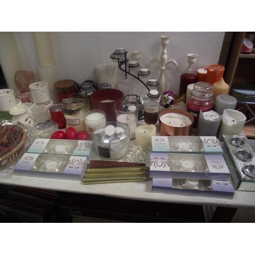 57 - A large lot of candles, candle holders, candle snuffers, tealights etc.