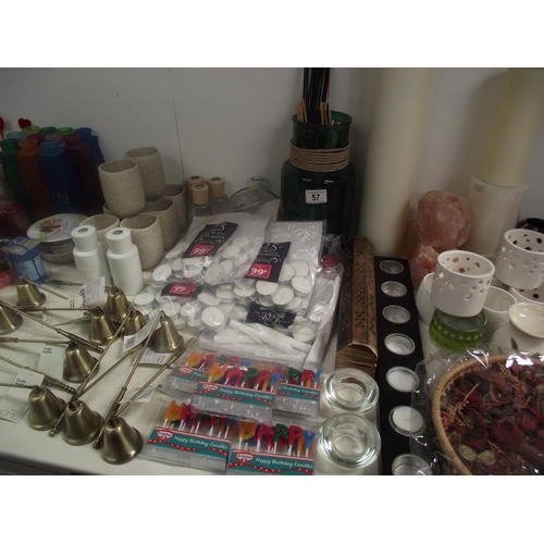 57 - A large lot of candles, candle holders, candle snuffers, tealights etc.