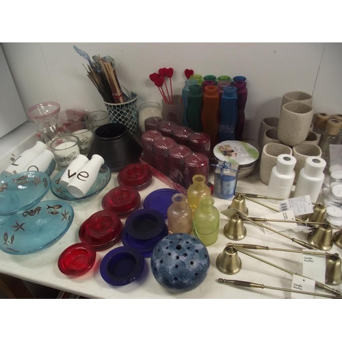 57 - A large lot of candles, candle holders, candle snuffers, tealights etc.