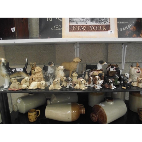 70 - A shelf full of dog ornaments