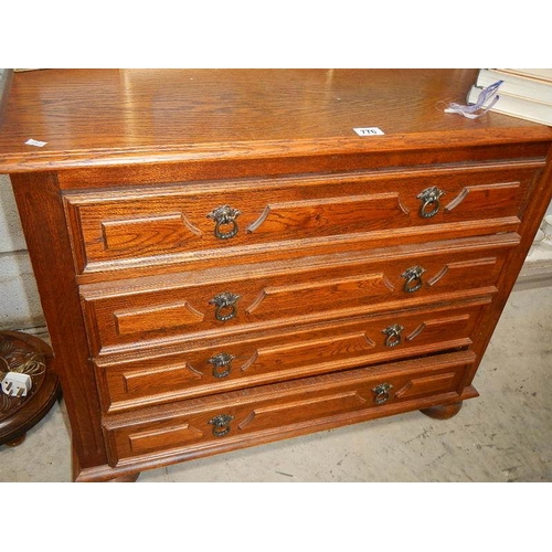 776 - An oak 4 drawer chest.