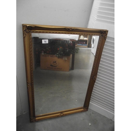 79 - A gilded framed mirror