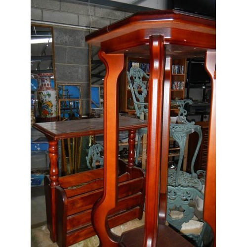 839 - 2 mahogany plant stands and a magazine rack.