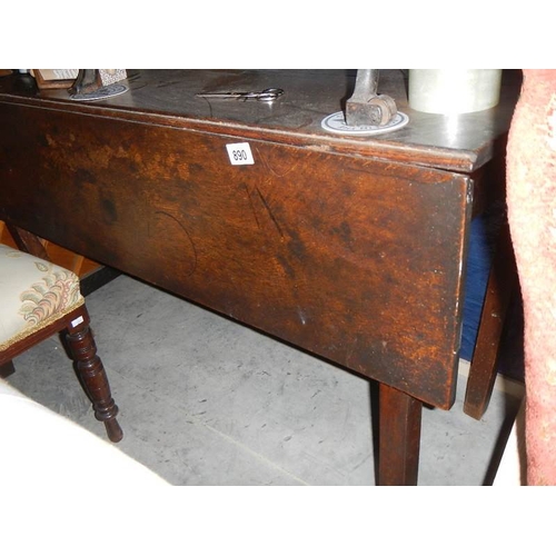 890 - An old gate leg table.