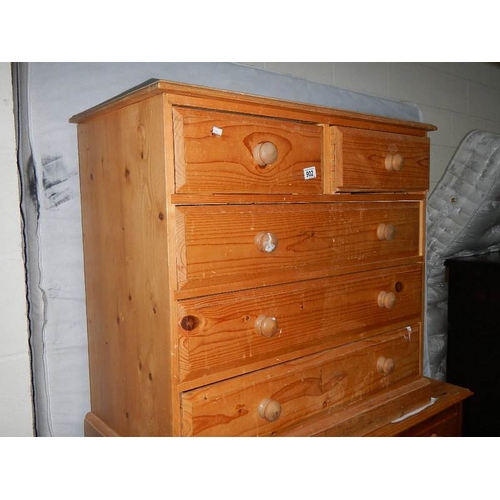 902 - A pine 2 over 3 chest of drawers.