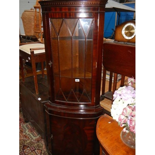 955 - A mahogany corner unit.