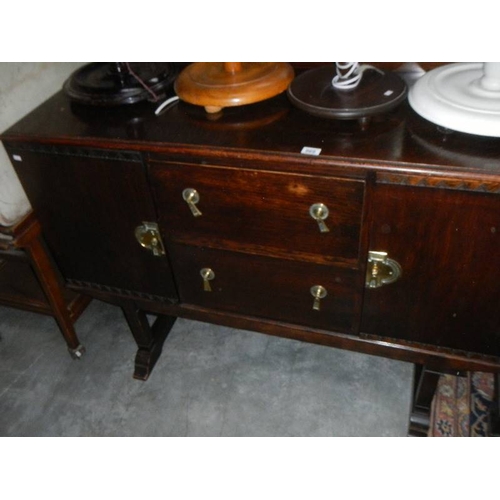 969 - An old oak sideboard.