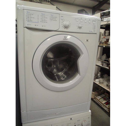 98 - An Indesit washing machine (damage to inspection panel)