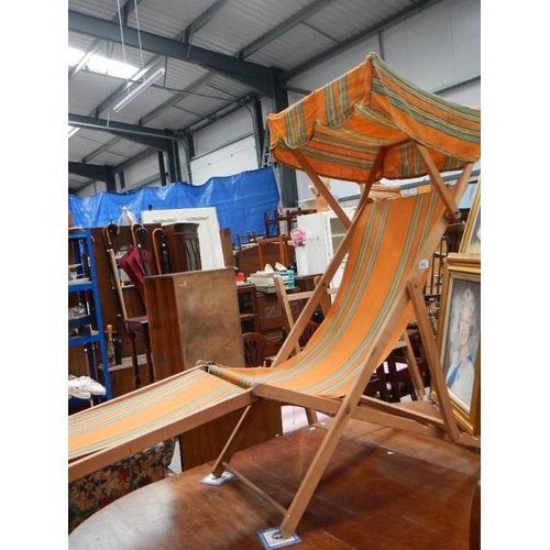 992 - An old retro deck chair with canopy.