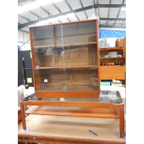 993 - A teak bookcase and a teak table.