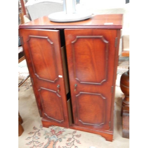 994 - A mahogany cabinet.