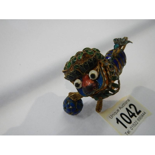 1042 - A Chinese jewelled dragon figure with nodding head.