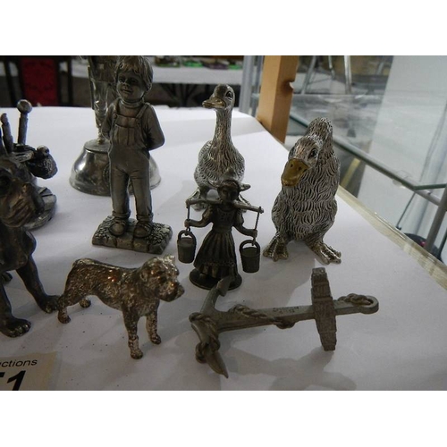 1051 - A mixed lot of metal figures including lace maker,  soldier, dogs, ducks etc.,