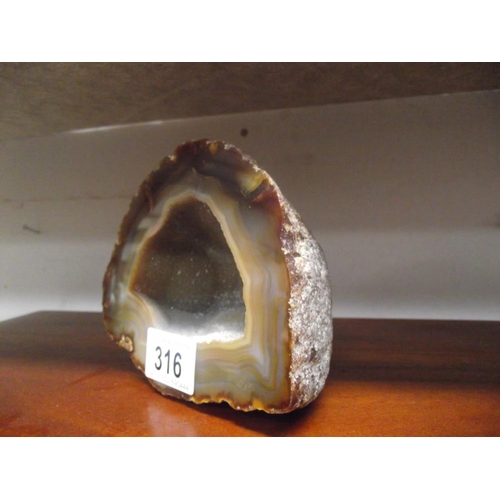 316 - A fossil polished stone crystal cave