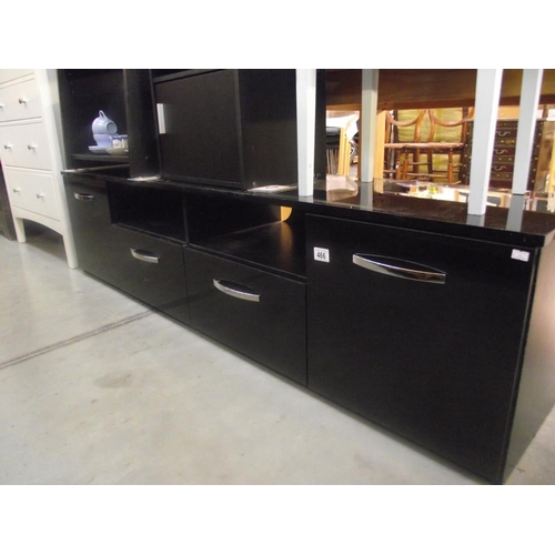 466 - A low black finished sideboard with cupboards and drawers