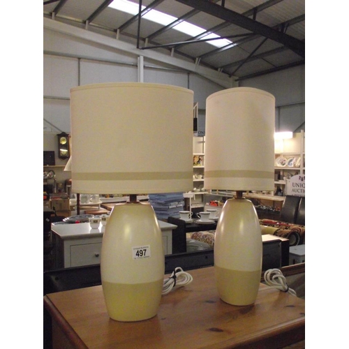 497 - A pair of pottery table lamps