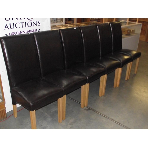 521 - A set of 6 high back leather dining chairs