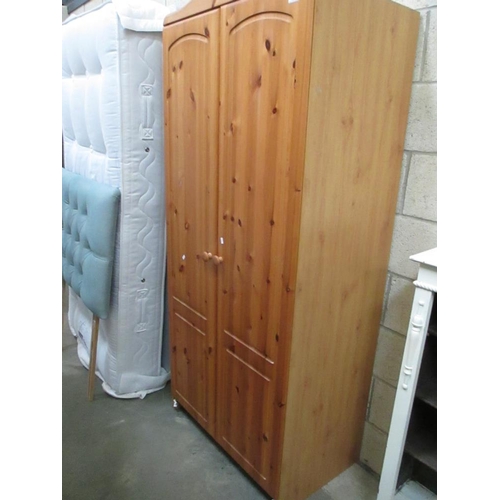 121 - A modern pine wardrobe (base facia panel needs re-fixing)