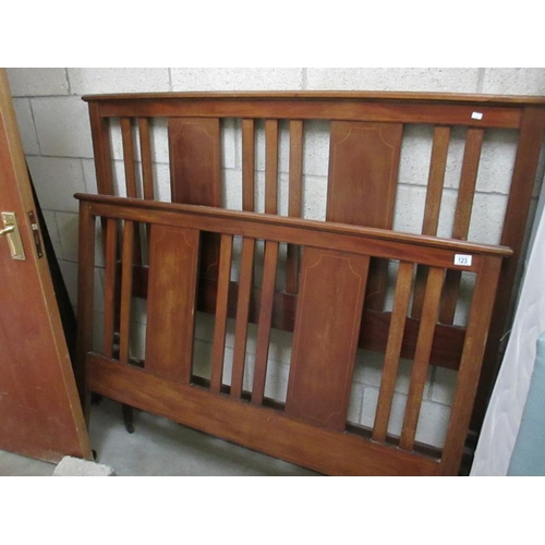 123 - An inlaid castored wood bedframe with metal siderails