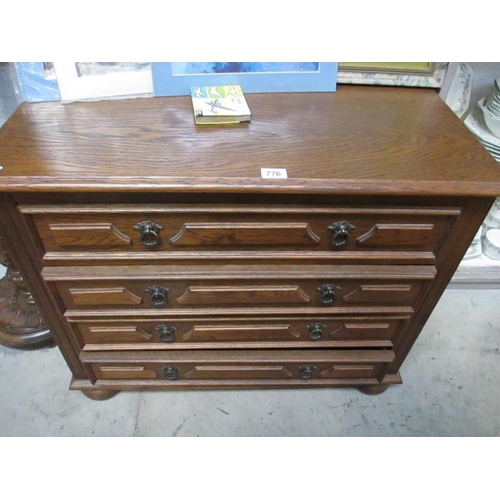 776 - An oak 4 drawer chest.