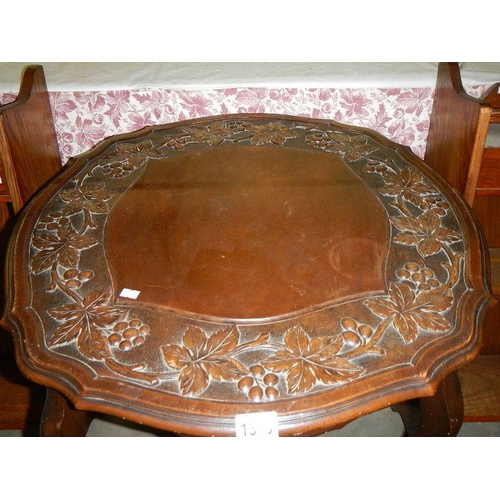 1300 - A carved top mahogany table.