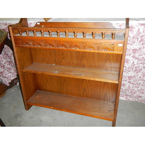 1301 - A pair of oak carved top book cases.