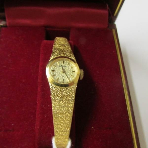 1 - A boxed Seiko make ladies wrist watch in yellow metal.