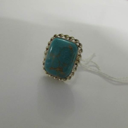 10 - A silver ring set turquoise, size O.