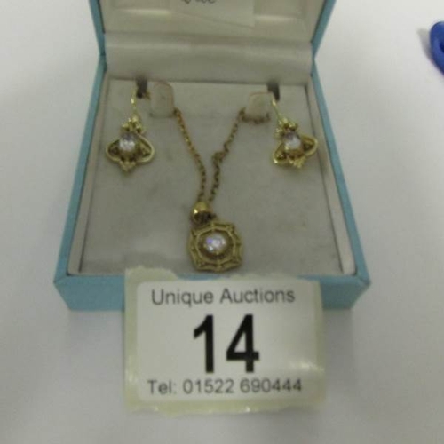 14 - A silver gilt necklace and earrings.