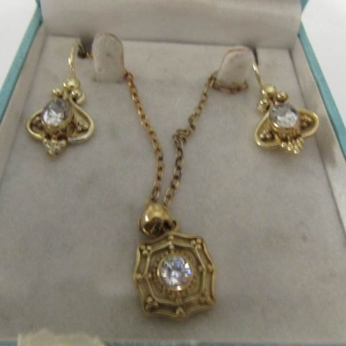 14 - A silver gilt necklace and earrings.