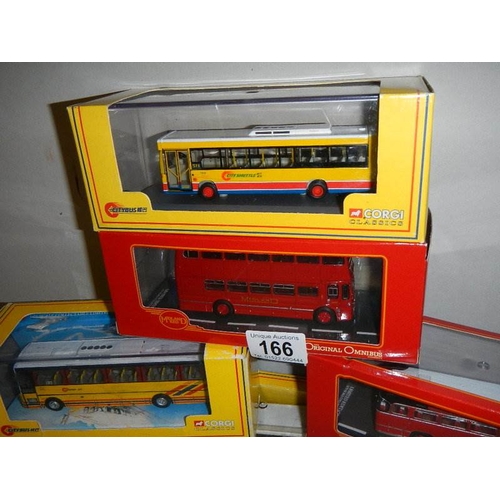 166 - Seven die cast Corgi model buses.