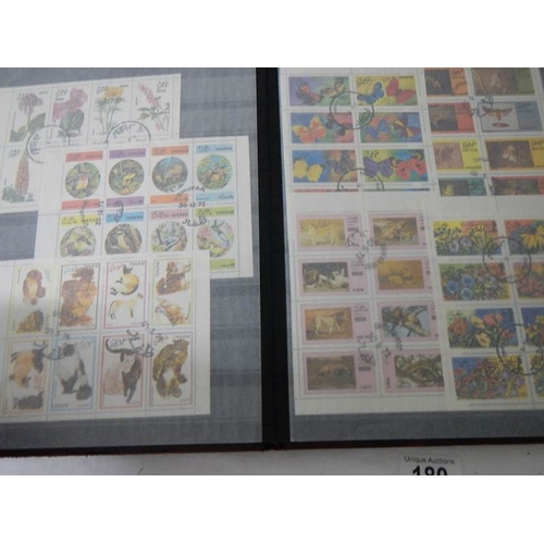 180 - 2 albums of worldwide Cinderella and back of book stamps.