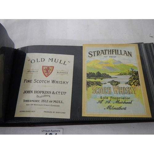 184 - 2 albums of whisky labels and mid 20th century beer mats.