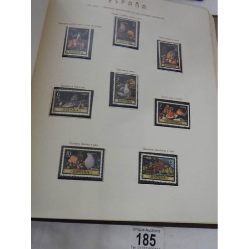 185 - A good collection of Spanish stamps in 5 albums plus reference books.