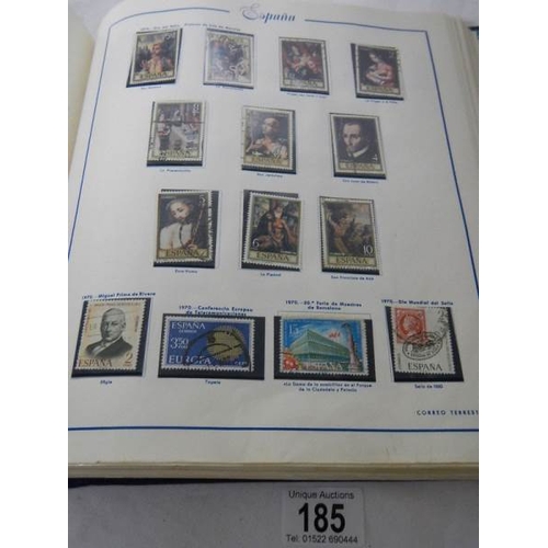 185 - A good collection of Spanish stamps in 5 albums plus reference books.