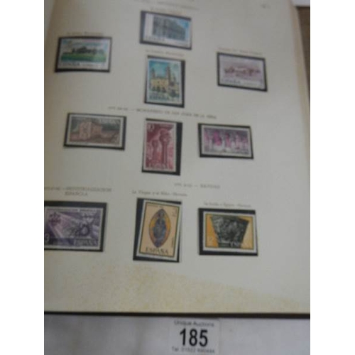 185 - A good collection of Spanish stamps in 5 albums plus reference books.