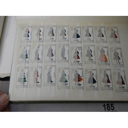 185 - A good collection of Spanish stamps in 5 albums plus reference books.