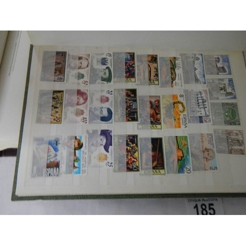 185 - A good collection of Spanish stamps in 5 albums plus reference books.