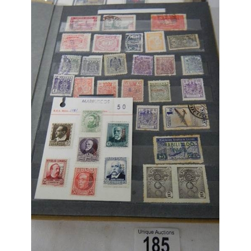 185 - A good collection of Spanish stamps in 5 albums plus reference books.