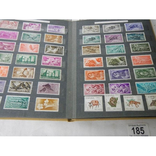 185 - A good collection of Spanish stamps in 5 albums plus reference books.