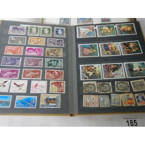 185 - A good collection of Spanish stamps in 5 albums plus reference books.