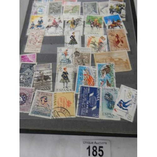 185 - A good collection of Spanish stamps in 5 albums plus reference books.