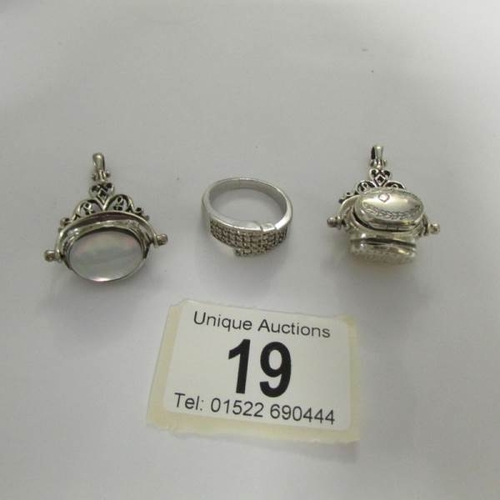 19 - A silver ring and 2 silver fobs.