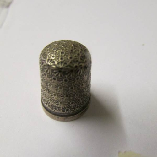 2 - A Charles Horner silver thimble and another silver thimble dated Birmingham 1925.