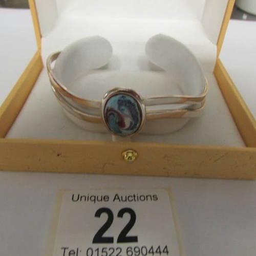 22 - An Irish silver plate and enamel bracelet.